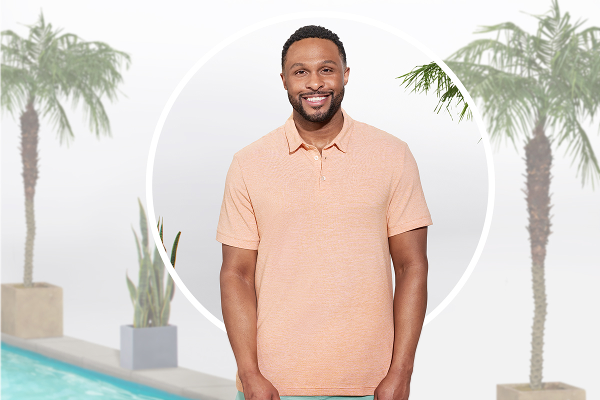 Smiling man wearing salmon-colored shirt